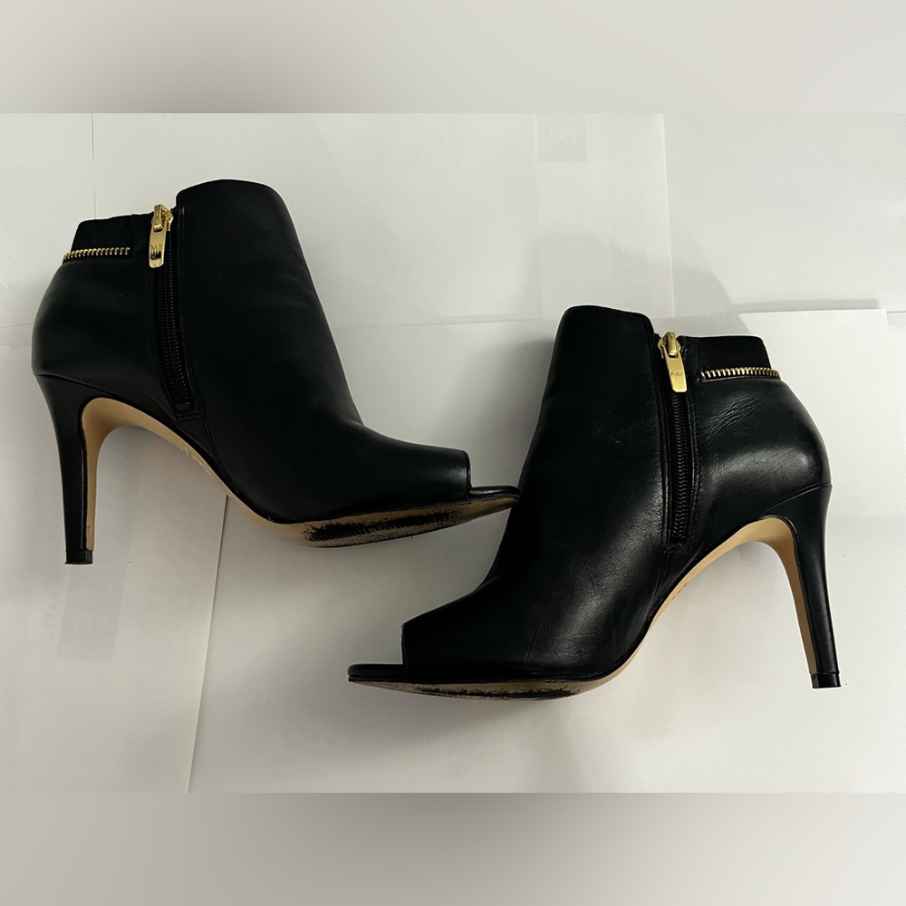 Marc Jacobs black leather, gold zippered, women’s shoe.